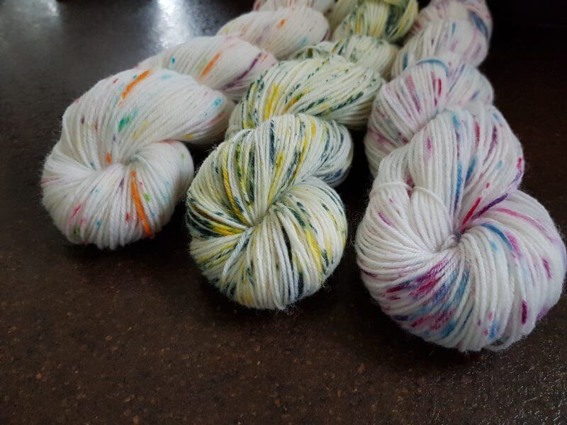set of 3 hand-dyed yarns using speckling techniques