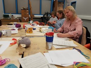students attending a crochet for beginners with Debbie Tomkies of dt craft and design