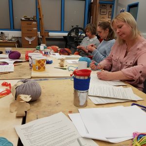 students attending a crochet for beginners with Debbie Tomkies of dt craft and design